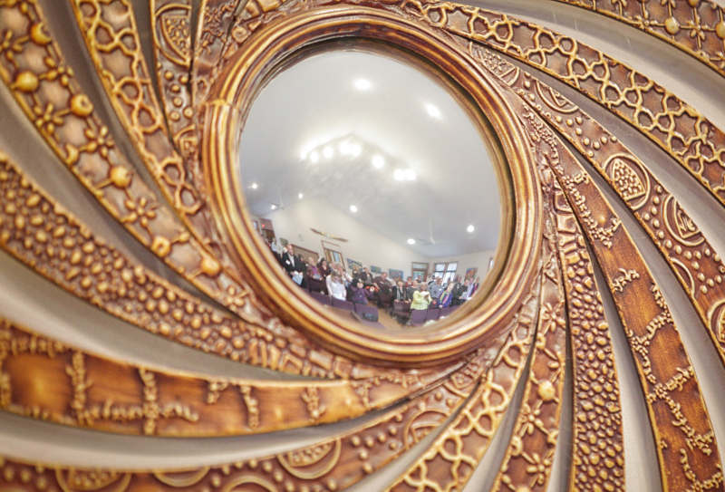 sprial mirror showing people in the sanctuary